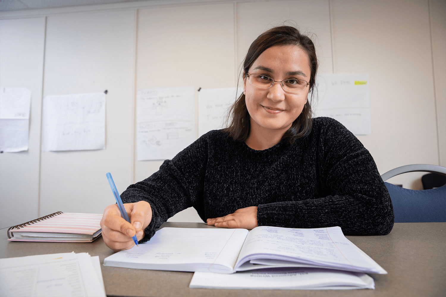 Adult student taking notes.